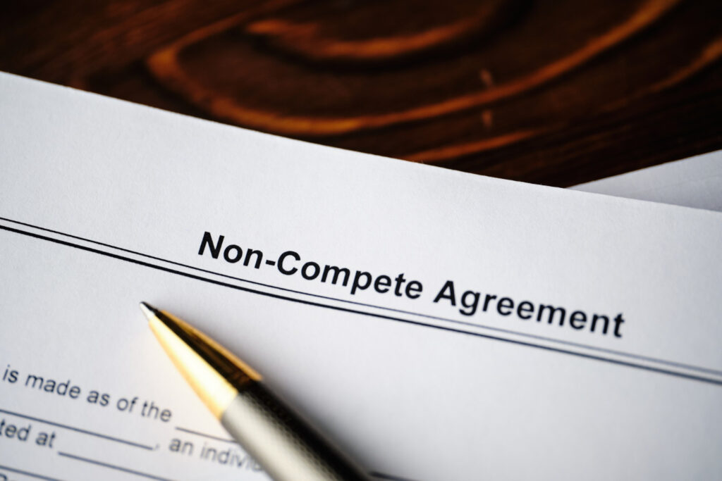 Legal document non-compete agreement on paper close up
